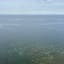 Weiter Blick hinaus auf das Meer mit Segelboot von der Ostküste im Norden Rügens