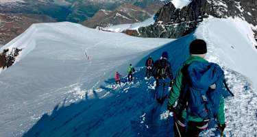 Nach dem gemeinsamen Gipfelerfolg beste Aussicht beim Abstieg