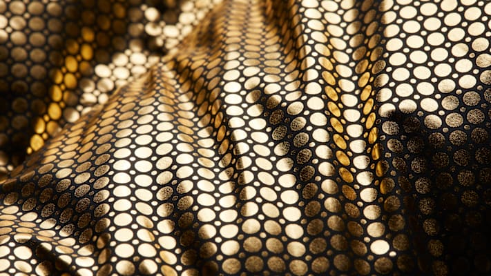 goldener Stoff mit Kreisen.